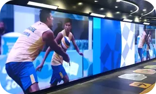 A large video wall along a corridor